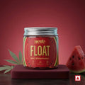 Jar of 'Float Wild Watermelon' by Hero on a red background with watermelon slices and leaves.